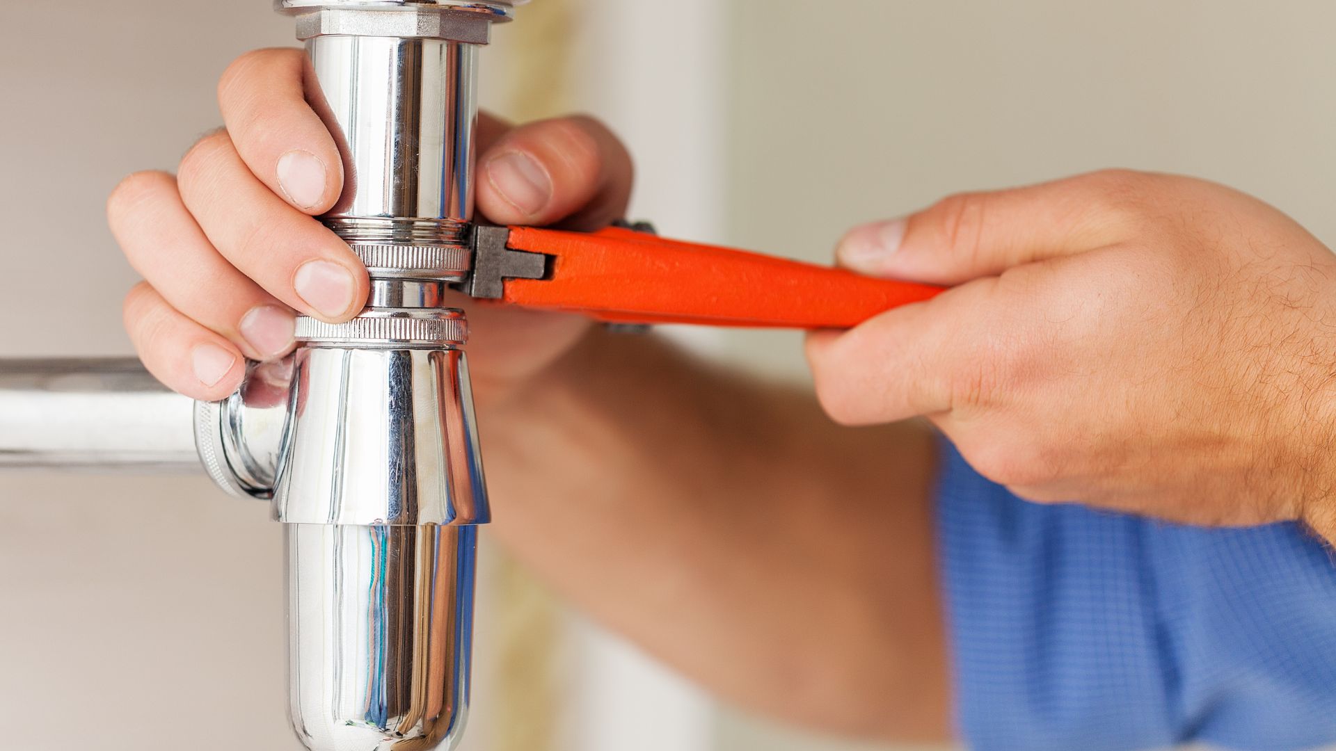 handyman fixing drain